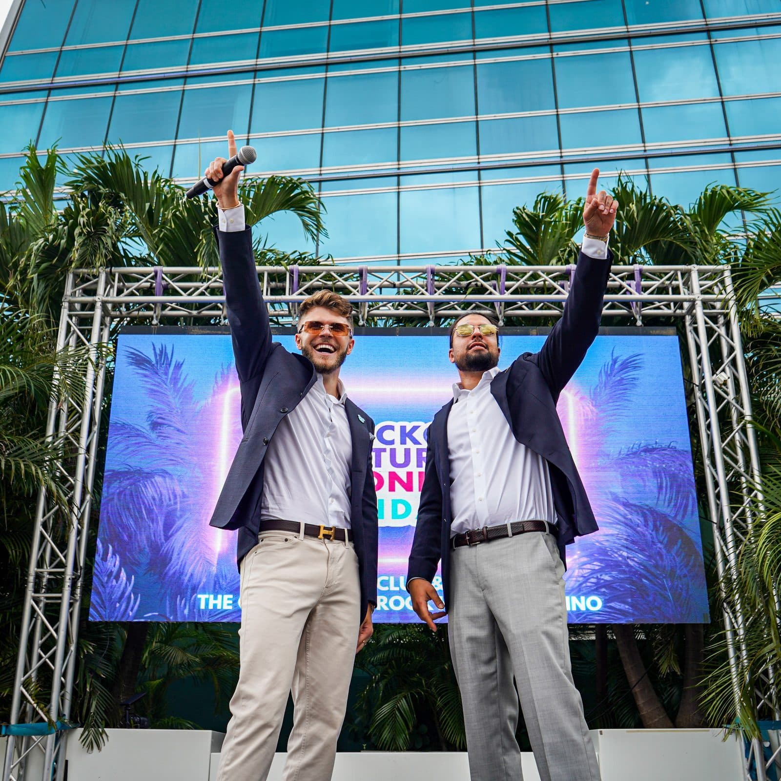 David Chaboki (GodsBurnt / Shibo) on stage at a public crypto conference event with co-host